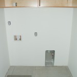 Cabinet and floor prep in the laundry room